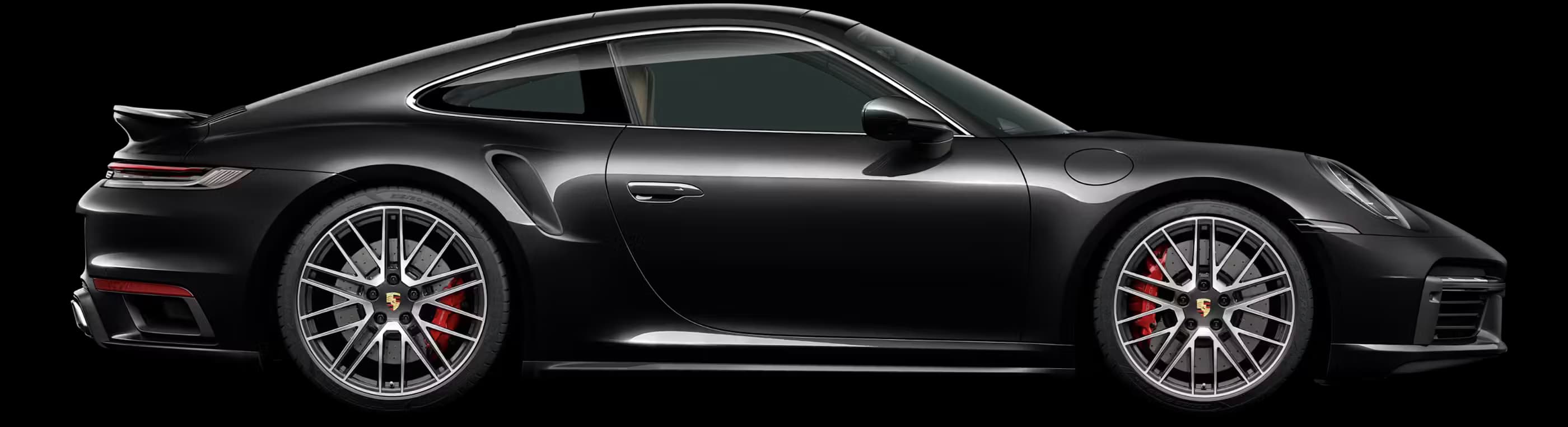 Side view/profile of the Porsche 911 Turbo in Jet Black Metallic.