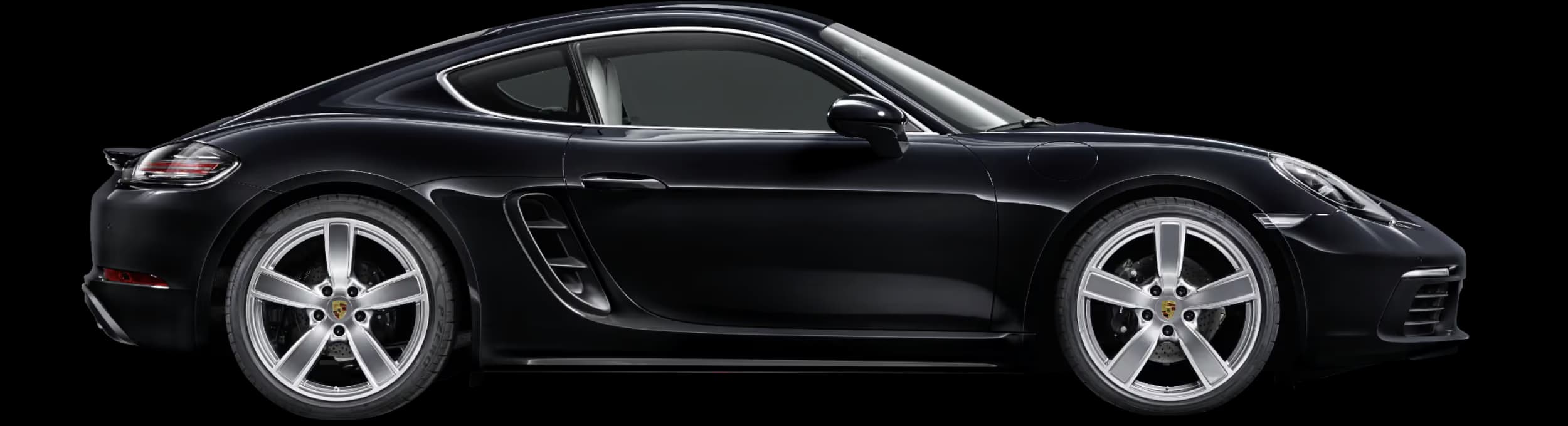 Porsche 718 Cayman in Jet Black Metallic in side view/in profile.