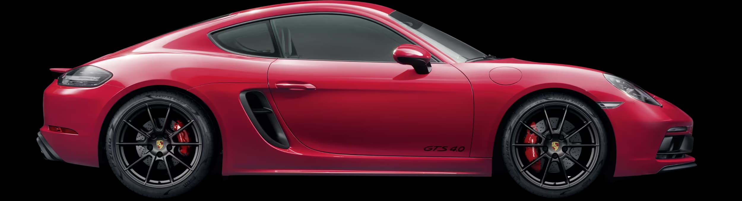 Side view/profile of the Porsche 718 Cayman GTS 4.0 in Carmine Red.