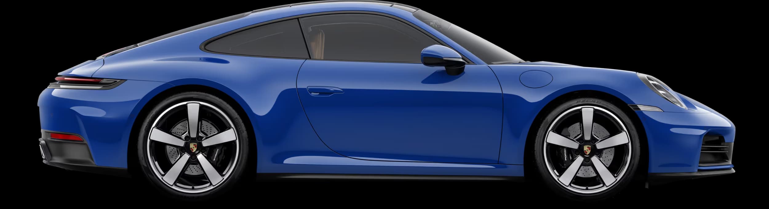Porsche 911 Carrera in Lugano Blue in profile/side view.