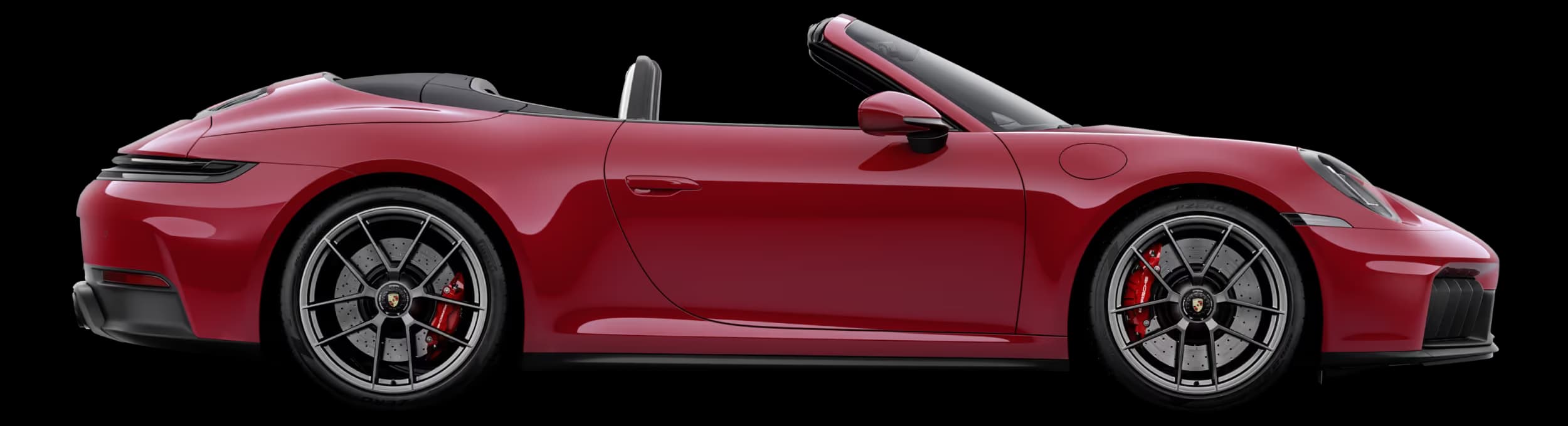 Porsche 911 Carrera 4 GTS Cabriolet in Carmine Red with roof in Black in profile/side view.